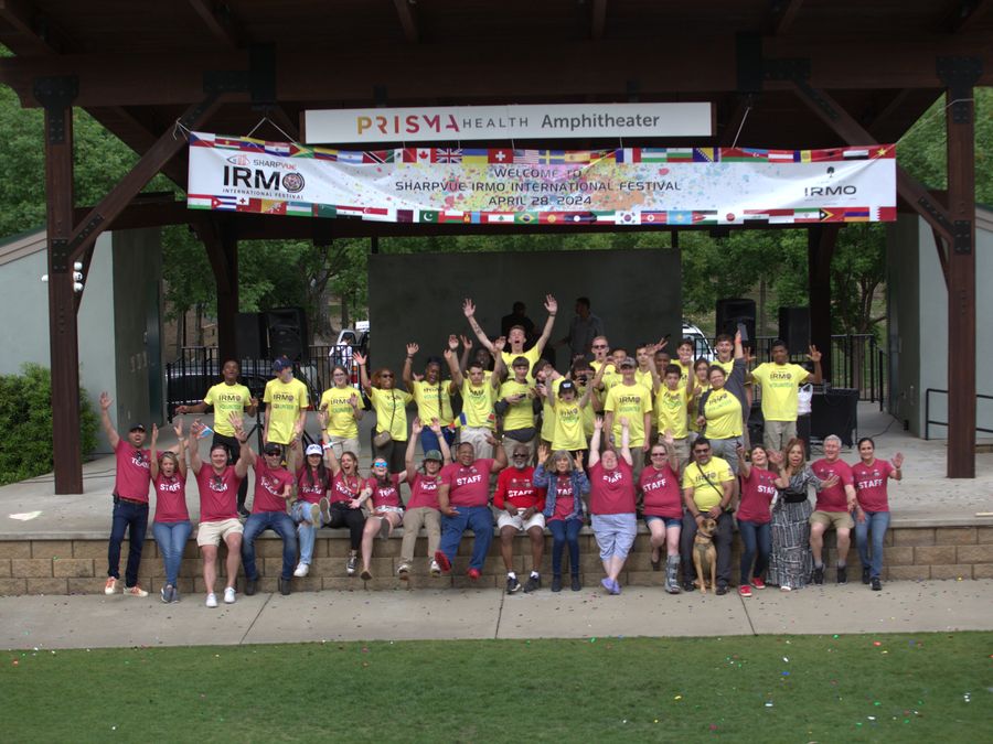 Festival volunteers and organizers on the Moore Park amphitheater stage